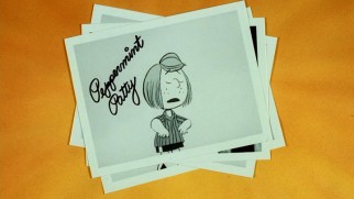 The theatrical trailer advertises the star power of "Race for Your Life, Charlie Brown" with Polaroids of Peppermint Patty and other characters.