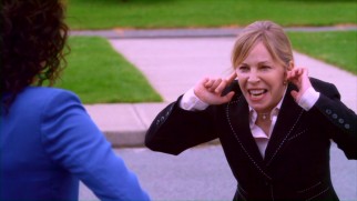Nasty Principal Moreno (Nancy Robertson) does not take kindly to SLAM FM's lunch time jam van stunt.