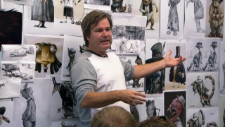 In front of a wall filled with concept art, director Gore Verbinski brings ILM animators up to speed on the movie.