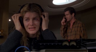 A freshly-bruised Kate Mullen (Rene Russo) listens anxiously as her husband makes a bold judgment call with the man who has kidnapped their son.