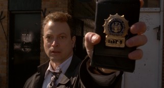 With a flash of his badge, Jimmy Shaker (Gary Sinise) reminds us he is a New York City cop gone bad.