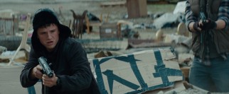 Josh Hutcherson keeps his head warm while engaging in guerilla warfare on the streets of Spokane, Washington.