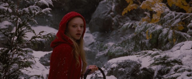 With basket in hand, Amanda Seyfried stars as Valerie, the young wearer of the titular red riding hood.