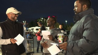 Director Tim Story talks with his two leading men on the set of "Ride Along."