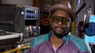 will.i.am talks about various things in "The Making of 'Hot Wings.'"