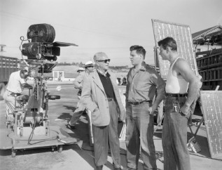 A behind-the-scenes photo from the filming of "Riot in Cell Block 11" livens up Kristoffer Tabori's reading of a book about his father, director Don Siegel.