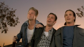 Peeved with Dude, antagonist Teddy Leather (Jason Wiles, right) and his unnamed cronies (Aaron Vaughn, Christian Klemash) turn to tormenting Donna.