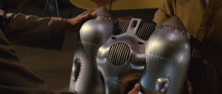 In a box on the back of a biplane, the jet pack is found.