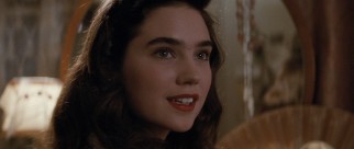 Transitioning from child acting to adult stardom, a 19/20-year-old Jennifer Connelly plays Cliff's girlfriend Jenny Blake, an aspiring actress whose look in the comic books was based on Bettie Page.