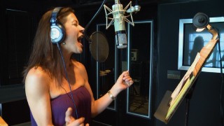 Catherine Zeta-Jones records a song in a behind-the-scenes music featurette.