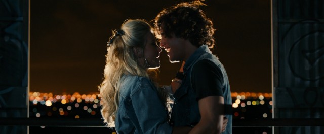 Aspiring singers Sherrie (Julianne Hough) and Drew (Diego Boneta) duet behind the Hollywood sign and above the bright lights of Los Angeles.