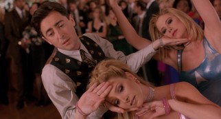 Romy (Mira Sorvino), Michele (Lisa Kudrow), and nerd turned billionaire Sandy Frink (Alan Cumming) show all their classmates how it is with a three-way dance number to "Time After Time."
