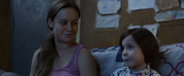 In "Room", a mother (Brie Larson) and her young son (Jacob Tremblay) are held captive in an 11' x 11' room for years.