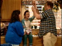 Roseanne and Dan aid an injured Darlene in the pilot episode "Life and Stuff."