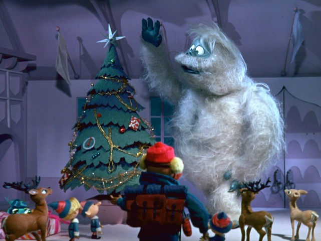 The Bumble, also known as The Abominable Snow Monster, puts a star atop Santa's Christmas tree in "Rudolph the Red-Nosed Reindeer."