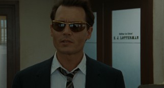 Paul Kemp (Johnny Depp) reports to the San Juan Star in sunglasses, allegedly to protect his conjunctivitis.