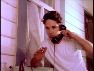 With a phone in one hand and a cigarette in the other, young Paul Stephen Rudd coolly masters the use of props.