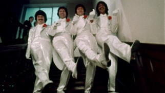 The Rutles descend a staircase in style.