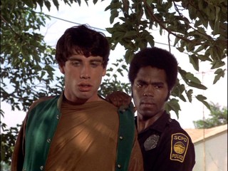 Terry arrests a 19-year-old John Travolta in "Frozen Smoke."
