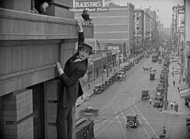 The once thrilling, long iconic climax of "Safety Last!" finds Harold Lloyd bravely dangling from a Los Angeles skyscraper above crowds of onlookers.