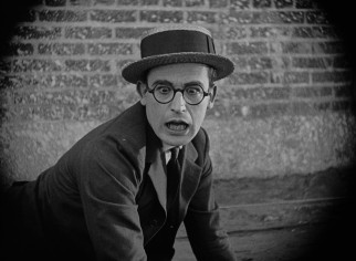 Harold Lloyd is surprised and none too pleased to spot a cop he recognizes in "Safety Last!"