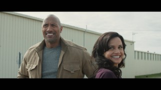 Dwayne Johnson and Carla Gugino share a laugh in the gag reel.