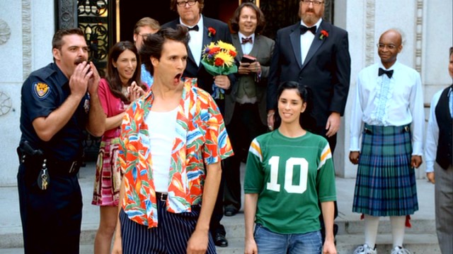 An Ace Ventura impersonator (Matthew Patrick Davis) joins Sarah and friends as they gather on the steps of Valley Village's town hall for Steve and Brian's gay wedding.