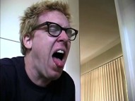 An uncharacteristically slim Steve Agee demonstrates his dry heaving skills while changing his roommate's cat's litter box in his audition short.