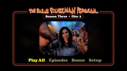 Sarah enjoys a jam band concert under the influence in Disc 2's main menu slideshow.