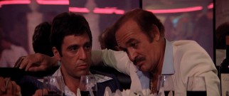 Miami cocaine kingpin Frank Lopez (Robert Loggia) takes Tony (Al Pacino) under his wing, quite literally here.