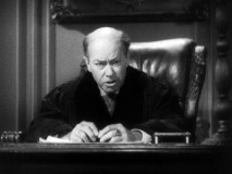 This judge (played by Robert Burress) removes his glasses to throw the metaphorical book at Tony in this alternate ending.