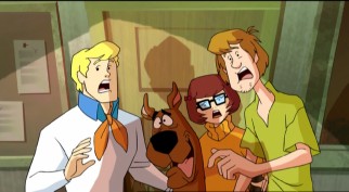 Fred, Scooby, Velma, and Shaggy are startled in "The Secret of the Ghost Rig."