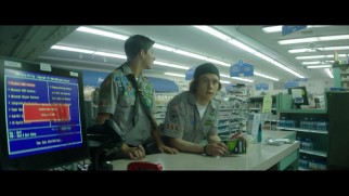 Ben (Tye Sheridan) and Carter (Logan Miller) wait to be helped at the counter of an oddly dead pharmacy in this deleted scene.