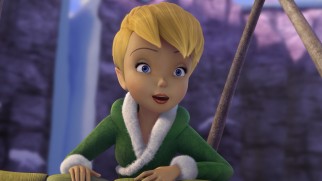 Sneaking a snowflake basket ride, Tinker Bell takes in the Winter Woods sights in her newly-designed warm outfit.