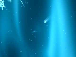 While the Merry Mistletoes' "We Three Kings" play, we see snowflakes fall against an electric blue backdrop.