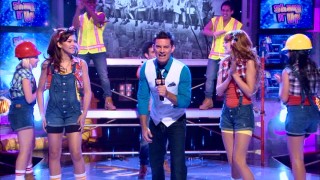"Shake It Up, Chicago!" host Gary Wilde (R. Brandon Johnson) excitedly introduces the girls' construction-inspired choreography sequence.