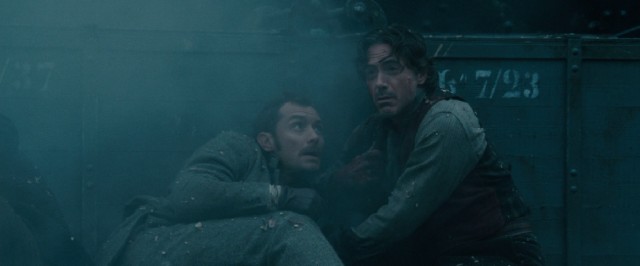 Dr. Watson (Jude Law) and Sherlock Holmes (Robert Downey Jr.) narrowly escape yet another close call.