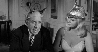 Now, that's subtle: the anti-Semitic Herr Rieber (Jose Ferrer) wears Devil's horns at a ship party he attends with his foolish mistress (Christiane Schmidtmer).