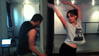 Bradley Cooper and Jennifer Lawrence hone their dancing skills in a brief montage of low-quality rehearsal footage.