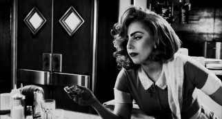 Picking up her second Robert Rodriguez film credit, Lady Gaga plays a roadside diner waitress who gives Johnny the only dollar he needs to get back at Senator Roark.