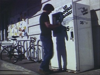 An unnamed man fills a jug with purified bottled in the type of action you'll find in Richard Linklater's first film, "It's Impossible to Learn to Plow by Reading Books."