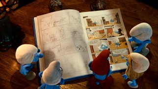 The Smurfs get some important information from one of Peyo's original Belgian comic books.