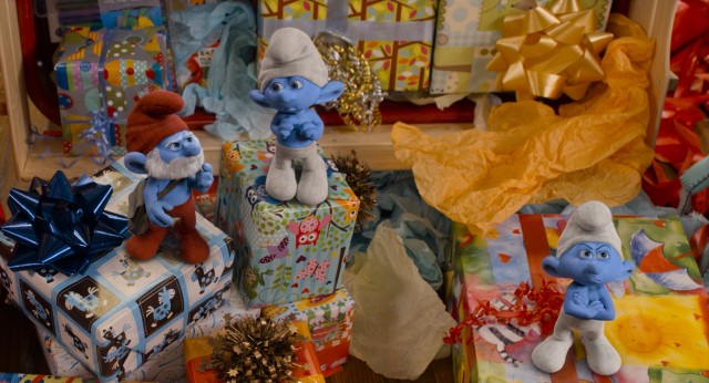Papa Smurf and company crash Blue's birthday party, his unwrapped presents being perfect pedestals and not brightly colored enough to overshadow their blue hue.