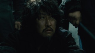 Nam (Song Kang Ho) reluctantly agrees to open gates for the revolution in exchange for kronole, his drug of choice.
