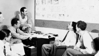 Walt and his animators look over Snow White storyboards in "Disney's First Feature."