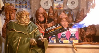 The wise golden Yogurt (Mel Brooks) demonstrates the power of merchandising with Spaceballs: The Flame Thrower.