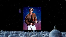 An art gallery shows images like this groovy Bill Pullman painting both in natural and black light.