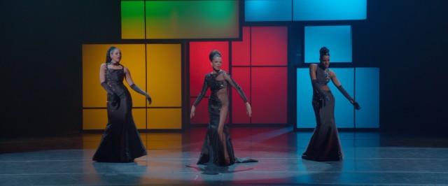 Sister and the Sisters perform in front of primary color rectangles.