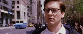 Back to being his plain old self, glasses and all, Peter Parker (Tobey Maguire) watches emergency vehicles speed by without feeling the need to suit up and be heroic.