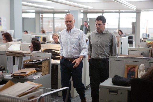 Walter "Robby" Robinson (Michael Keaton) and Mike Rezendes (Mark Ruffalo) walk and talk through the offices of The Boston Globe.